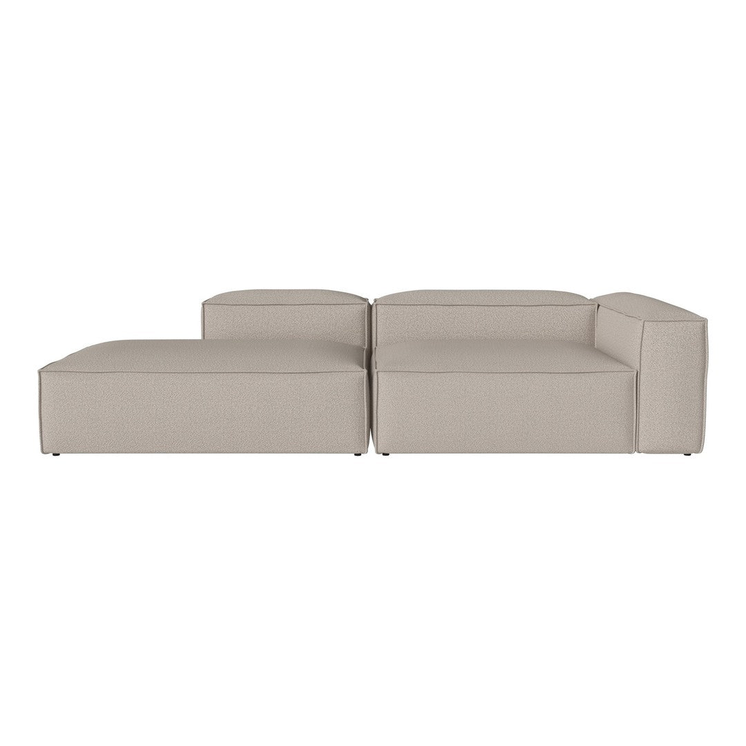 Beige sectional sofa with sleek lines and a minimalist design. Perfect for modern living spaces.