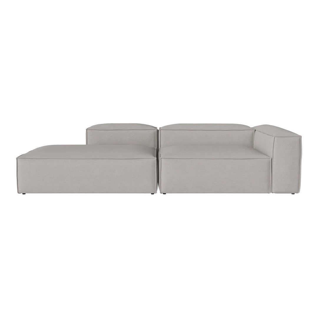 Light gray modular sofa with a minimalist design and clean lines, featuring a solid color without patterns.