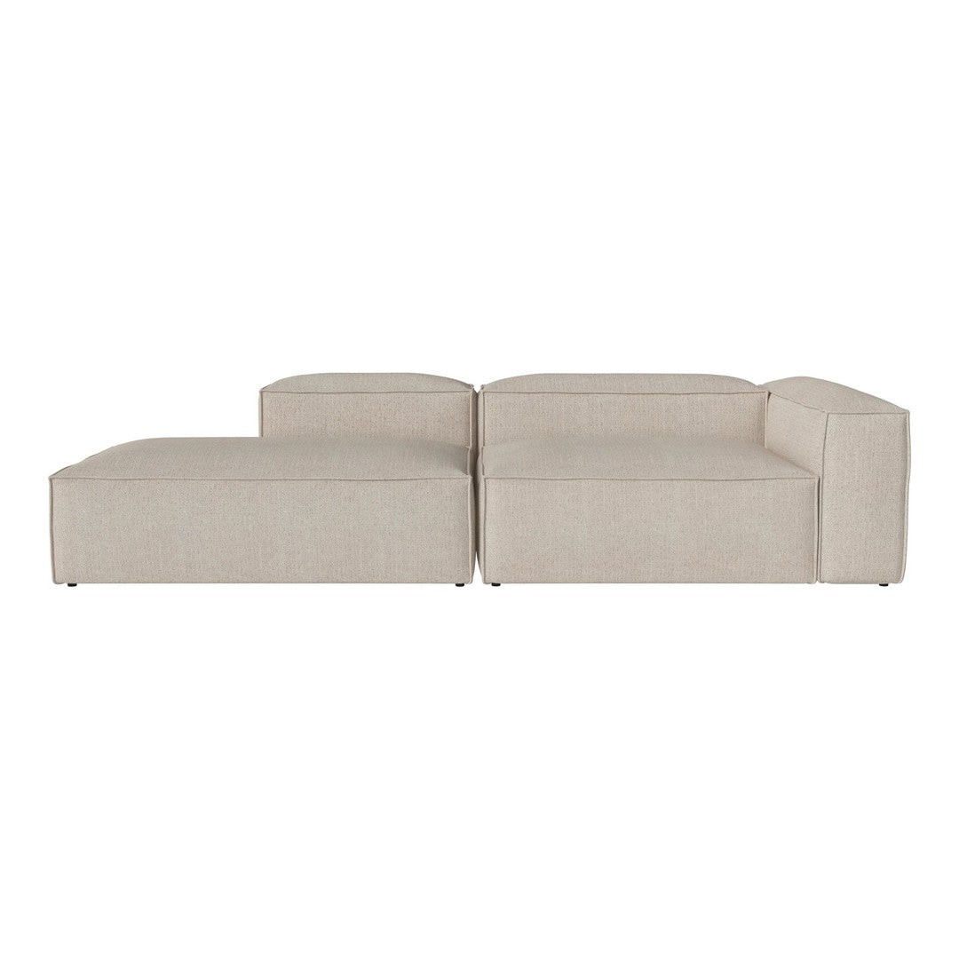 Light beige sectional sofa with clean lines and a minimalist design. Soft fabric with a subtle texture.