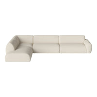 Cream-colored sectional sofa with smooth, minimalist design and seamless curves. Ideal for modern living spaces.