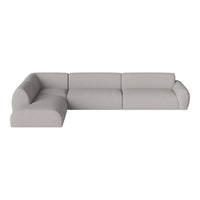 Light gray sectional sofa with soft, smooth fabric and rounded edges for a modern, minimalist aesthetic.