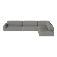 Gray sectional sofa with a smooth fabric texture and modern, minimalist design. Ideal for contemporary living spaces.
