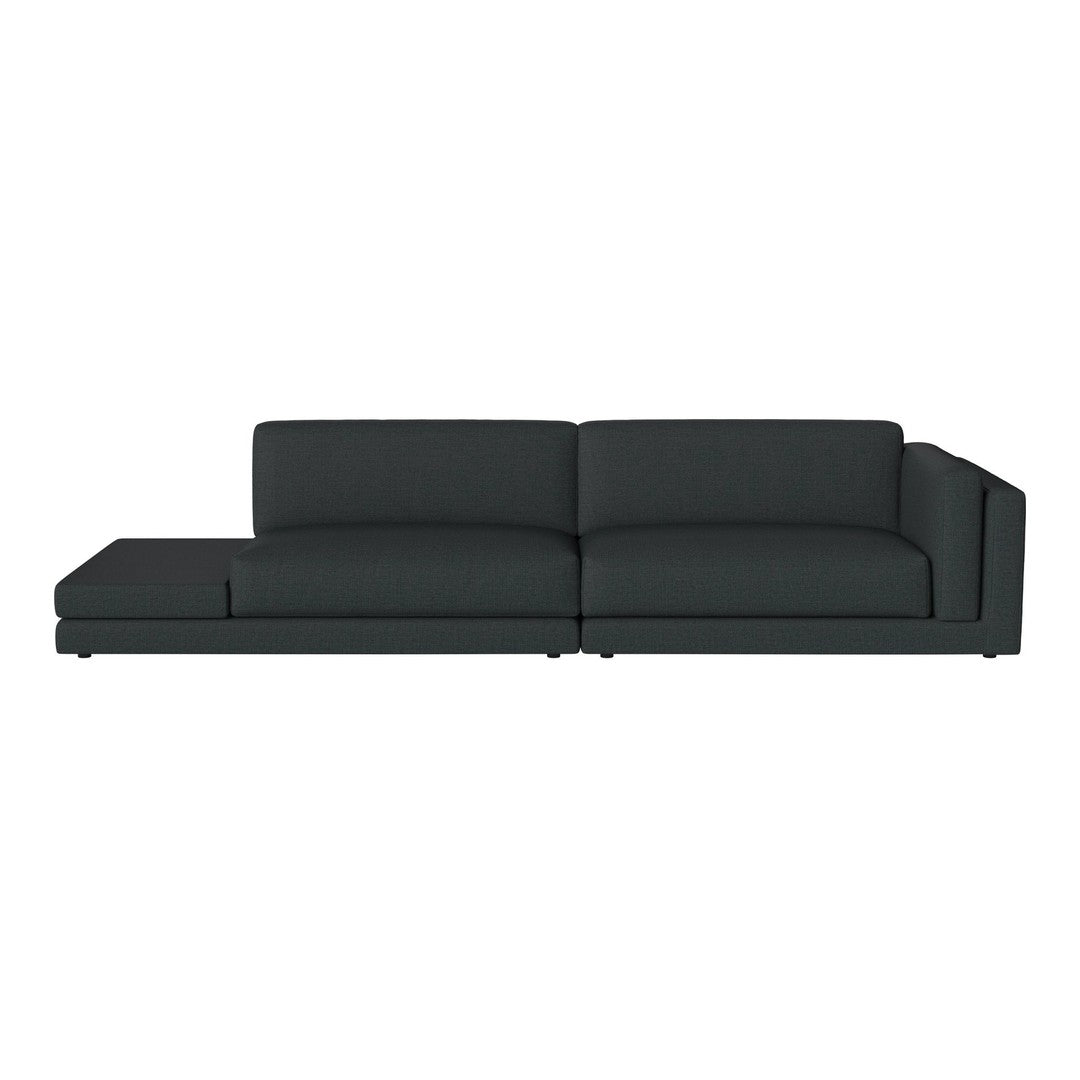 Modern dark gray sectional sofa with clean lines and smooth fabric, perfect for contemporary living spaces.