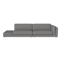 Gray sectional sofa with a modern design and smooth fabric texture, perfect for contemporary living spaces.
