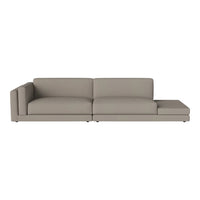 Sleek, modern sofa in a soft beige color, featuring a minimalist design with clean lines and a smooth finish.
