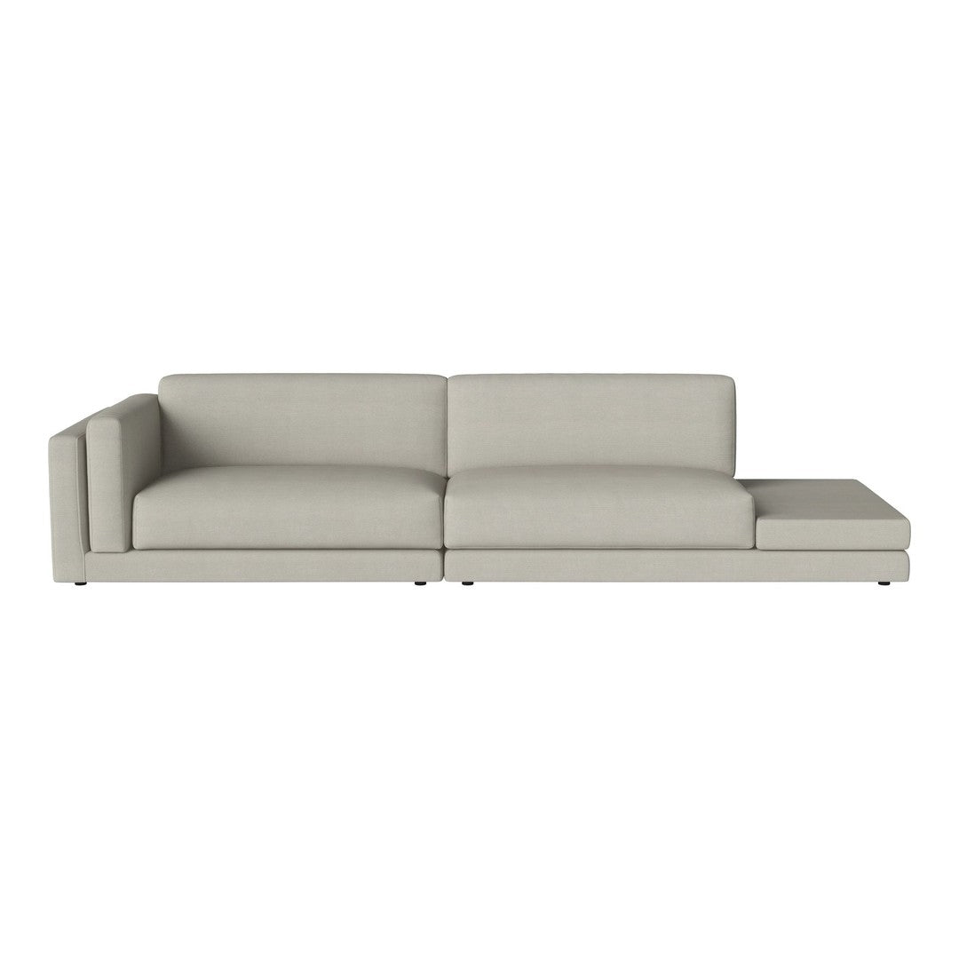 Light gray sectional sofa with a smooth fabric texture, featuring a minimalist design and clean lines.