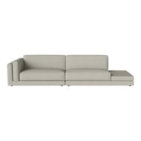 Light gray sectional sofa with a smooth fabric texture, featuring a minimalist design and clean lines.