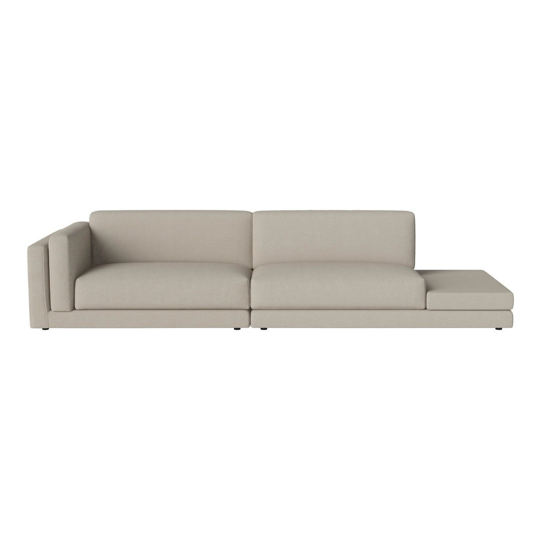 Light beige sectional sofa with a minimalist design and smooth fabric upholstery. Ideal for modern decor.