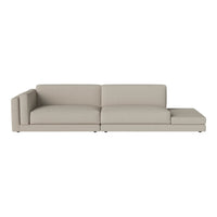 Light beige sectional sofa with a minimalist design and smooth fabric upholstery. Ideal for modern decor.