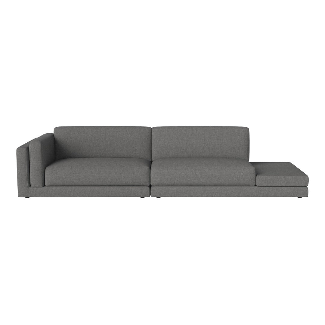 Modern gray sectional sofa with a sleek design and textured fabric, perfect for contemporary living spaces.