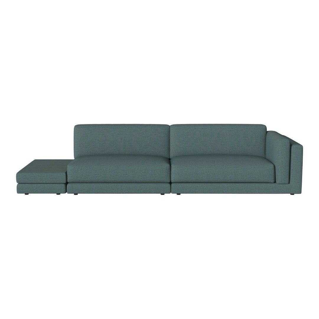 Teal sectional sofa with a modern, clean design and textured upholstery, perfect for contemporary living spaces.