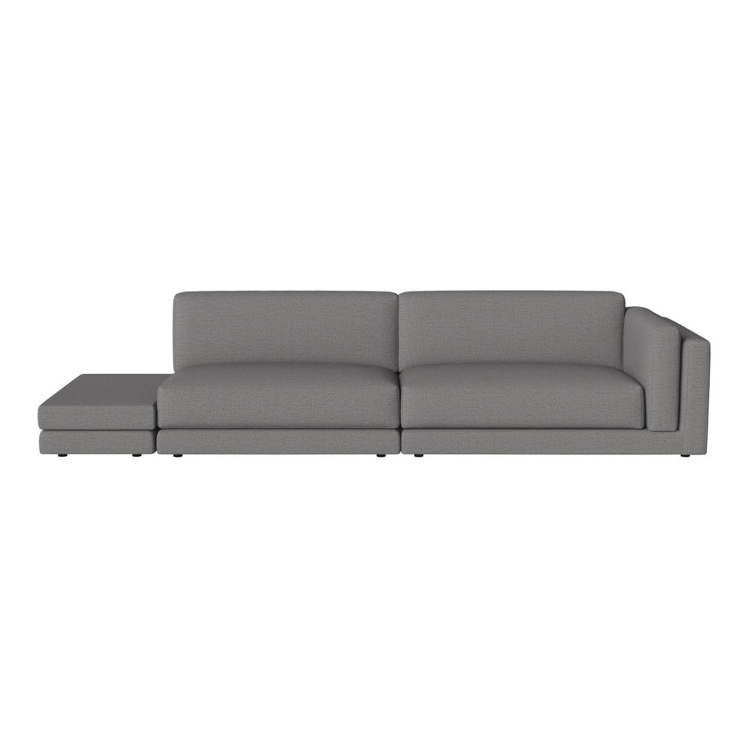 Gray sectional sofa with a modern, minimalist design and smooth fabric upholstery. Perfect for contemporary living spaces.