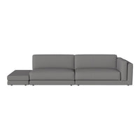 Gray sectional sofa with a modern, minimalist design and smooth fabric upholstery. Perfect for contemporary living spaces.
