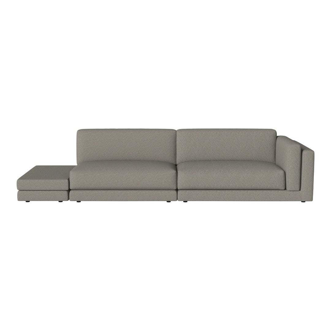 Modern gray sectional sofa with a sleek design and clean lines, featuring a solid fabric upholstery.