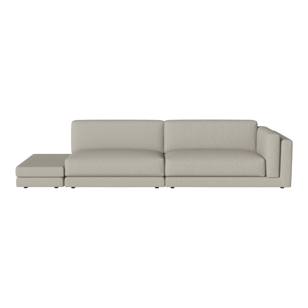 Light gray sectional sofa with smooth, solid fabric and sleek modern design. Ideal for contemporary living spaces.