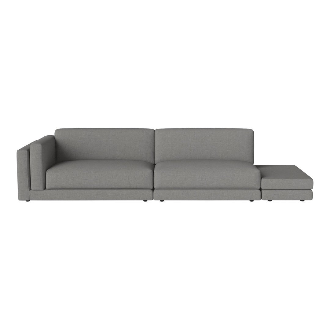 "Modern gray sectional sofa with sleek lines and minimalist design, perfect for contemporary living spaces."