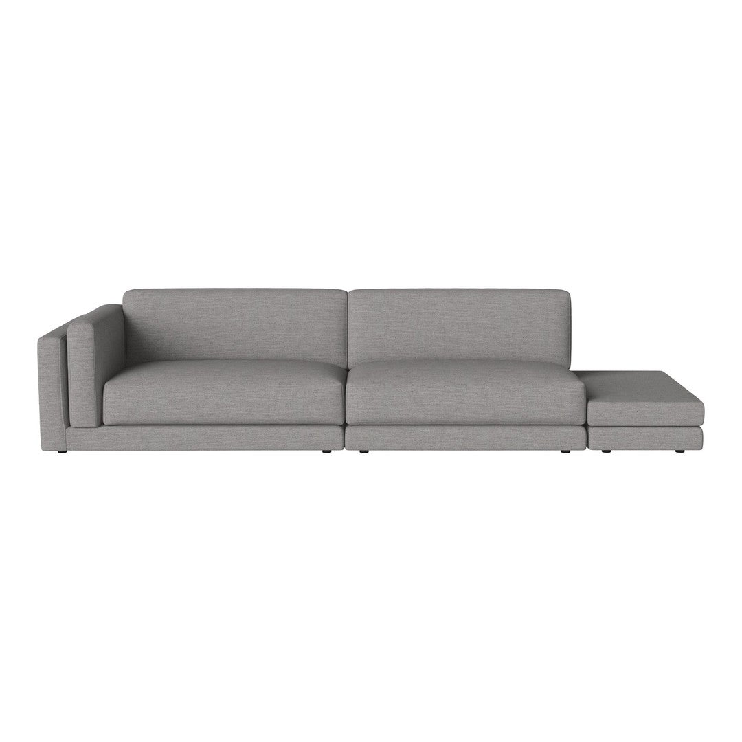 Modern gray sectional sofa with clean lines and a minimalistic design, featuring a soft fabric texture.