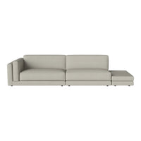 Light gray sectional sofa with a sleek, minimalist design and smooth fabric upholstery. Ideal for modern living spaces.