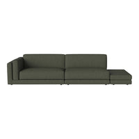 Modern green sectional sofa with a sleek design and textured fabric, perfect for contemporary living spaces.