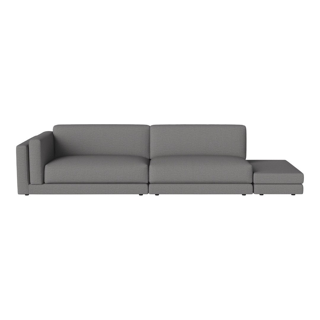 Modern grey sectional sofa with a sleek, minimalist design and smooth fabric upholstery. Ideal for contemporary interiors.