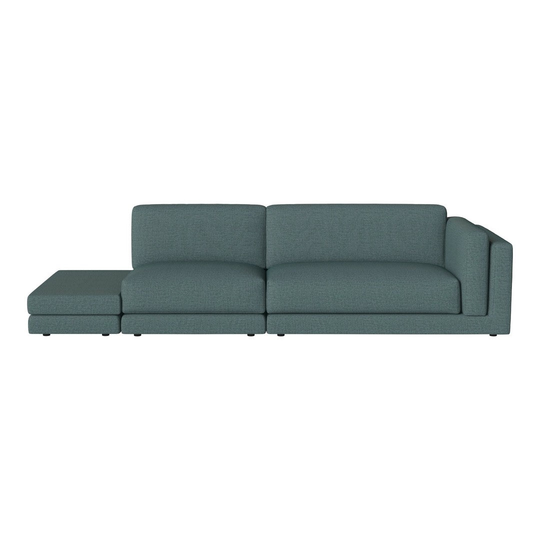 Soft teal sectional sofa with a sleek, modern design and clean lines, perfect for contemporary living spaces.