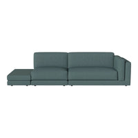 Soft teal sectional sofa with a sleek, modern design and clean lines, perfect for contemporary living spaces.