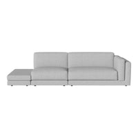 Light gray sectional sofa with a modern design and smooth fabric pattern, ideal for contemporary living spaces.