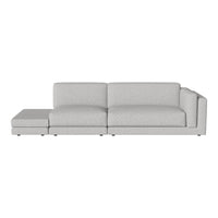 Light gray sectional sofa with a smooth fabric texture and minimalist design. Perfect for modern living spaces.