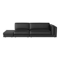 Modern black leather sectional sofa with sleek lines and smooth texture, perfect for contemporary living spaces.