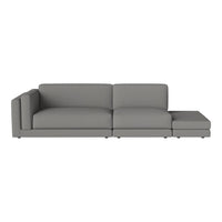 Gray fabric sectional sofa with sleek, modern lines and no visible patterns for a minimalist look.