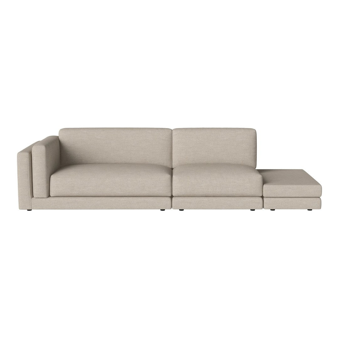 Light beige sectional sofa with a minimalist design, featuring smooth, solid fabric upholstery.