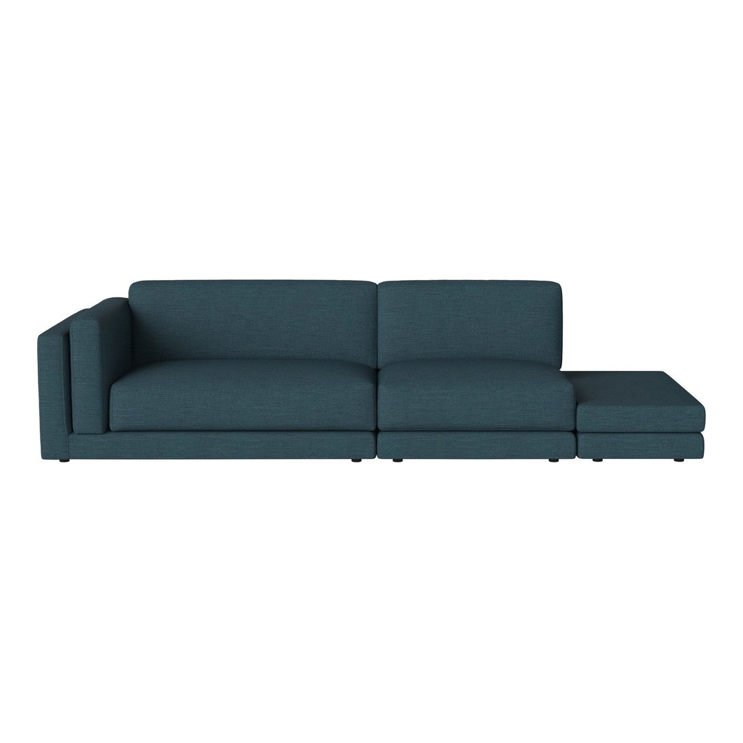 Teal sectional sofa with a modern design and clean lines, featuring a solid color and no visible patterns.
