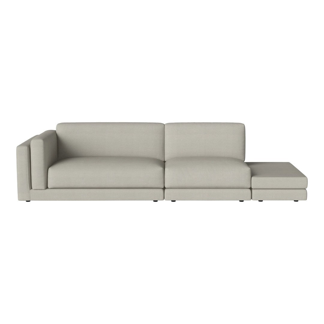 Light gray sectional sofa with a minimalist design and smooth, solid fabric texture.