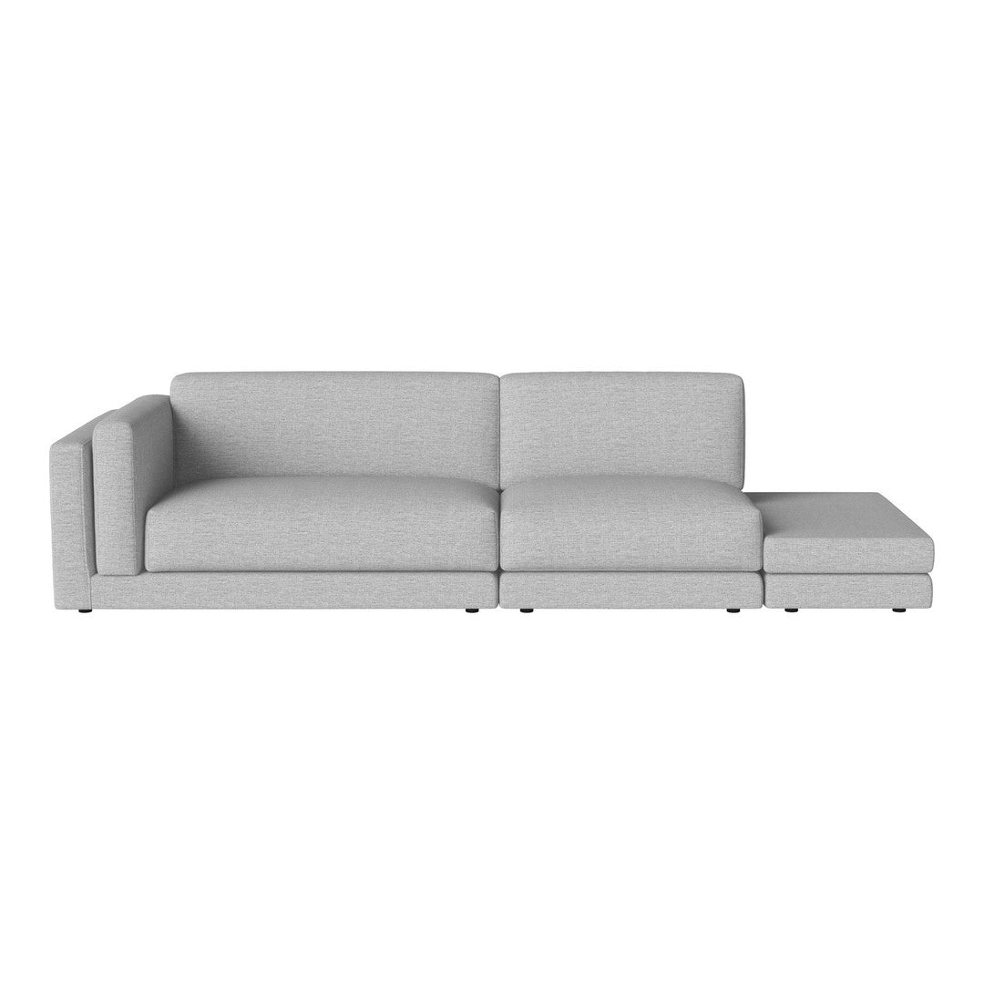 Light gray sectional sofa with a modern, minimalist design, featuring smooth upholstery and clean lines.