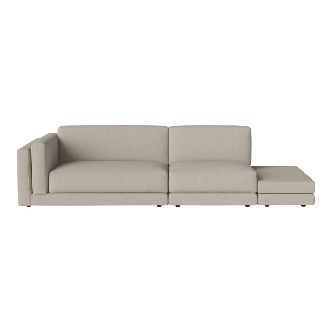 Beige sectional sofa with a modern, minimalist design, featuring clean lines and a soft, textured fabric.