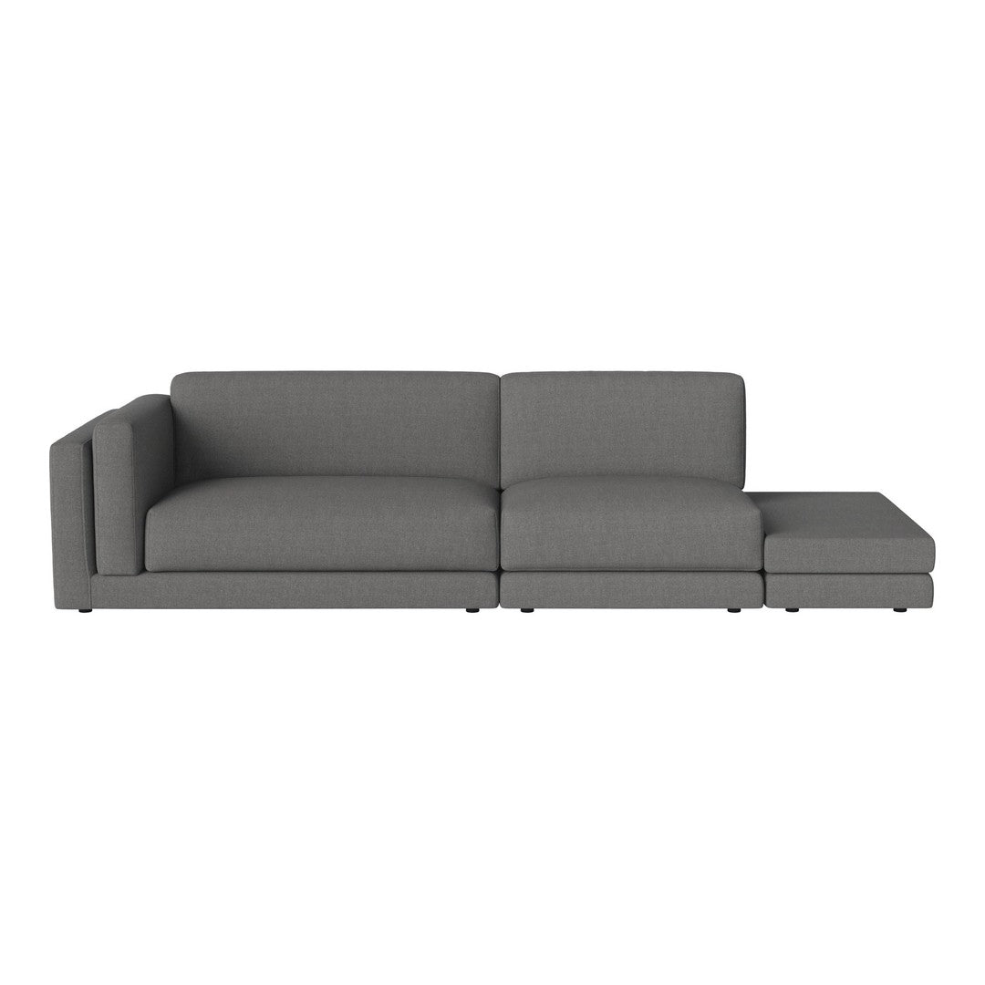 Gray sectional sofa with a minimalist design, featuring a smooth, solid fabric pattern. Ideal for modern interiors.