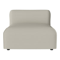 Light beige, minimalist chair with smooth, curved lines and a solid color pattern, perfect for modern decor.