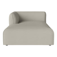 Neutral beige chaise lounge with a smooth, minimalist design and subtle curved armrest, perfect for modern decor.