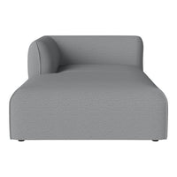 Gray chaise lounge with a smooth, textured fabric and minimalistic design. Perfect for modern interiors.