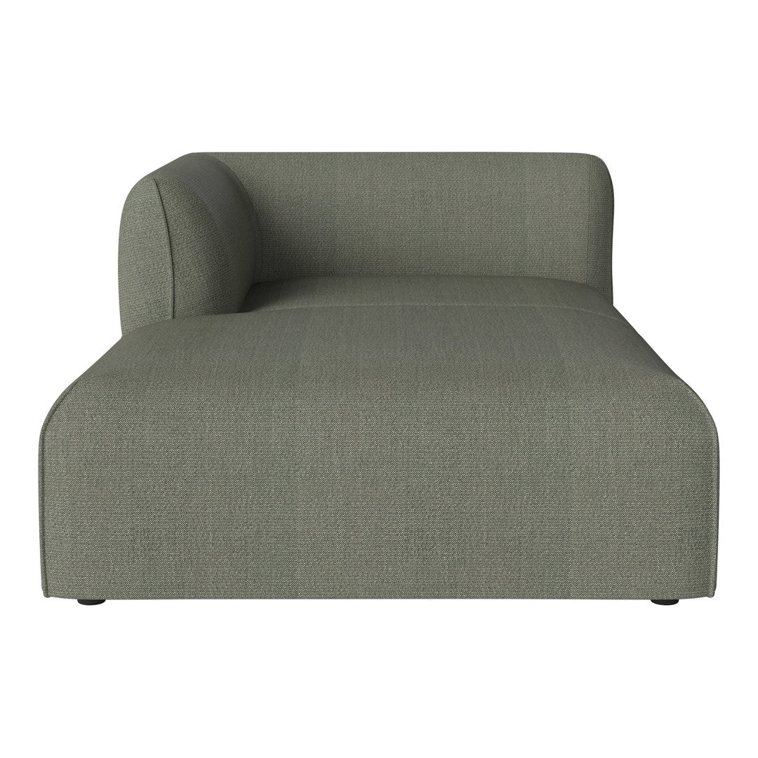 Sleek green chaise lounge with a minimalist design and subtle textured fabric. Perfect for modern decor.