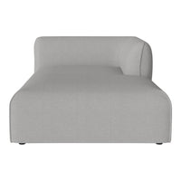 Light gray, minimalist chaise lounge with a smooth, solid fabric texture and modern, curved edges.
