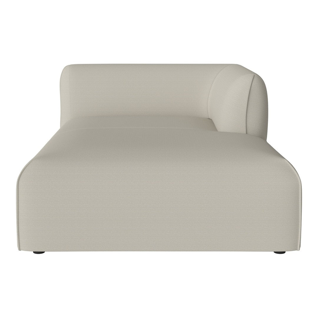 Modern beige chaise lounge with a sleek, minimalist design and smooth fabric texture. Ideal for contemporary interiors.