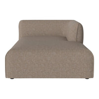 "Textured beige chaise lounge with a smooth, modern design, featuring a curved back and minimalist silhouette."