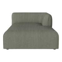 Stylish chaise lounge in soft olive green fabric with a subtle, textured pattern. Perfect for modern decor.