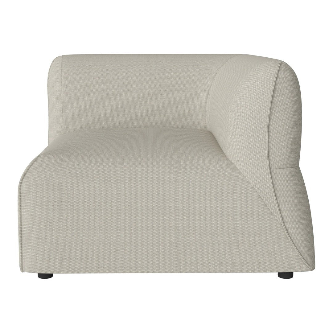 Beige curved accent chair with smooth texture and modern design, ideal for contemporary interiors.