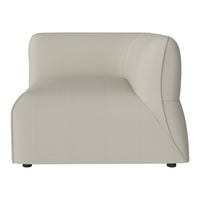 Beige curved accent chair with smooth texture and modern design, ideal for contemporary interiors.