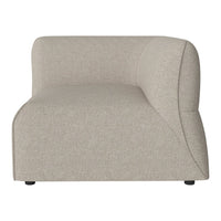 Beige curved sofa section with a smooth textured fabric, perfect for modern minimalist decor.