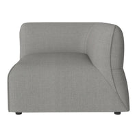 Soft gray modular sofa section with a smooth, textured fabric and modern curved design. Perfect for contemporary decor.