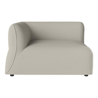 Modern curved sofa in soft beige with a smooth surface and minimalist design, ideal for contemporary decor.