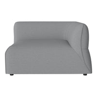 Grey textured sectional sofa with smooth curves and minimalistic design. Perfect for modern living spaces.
